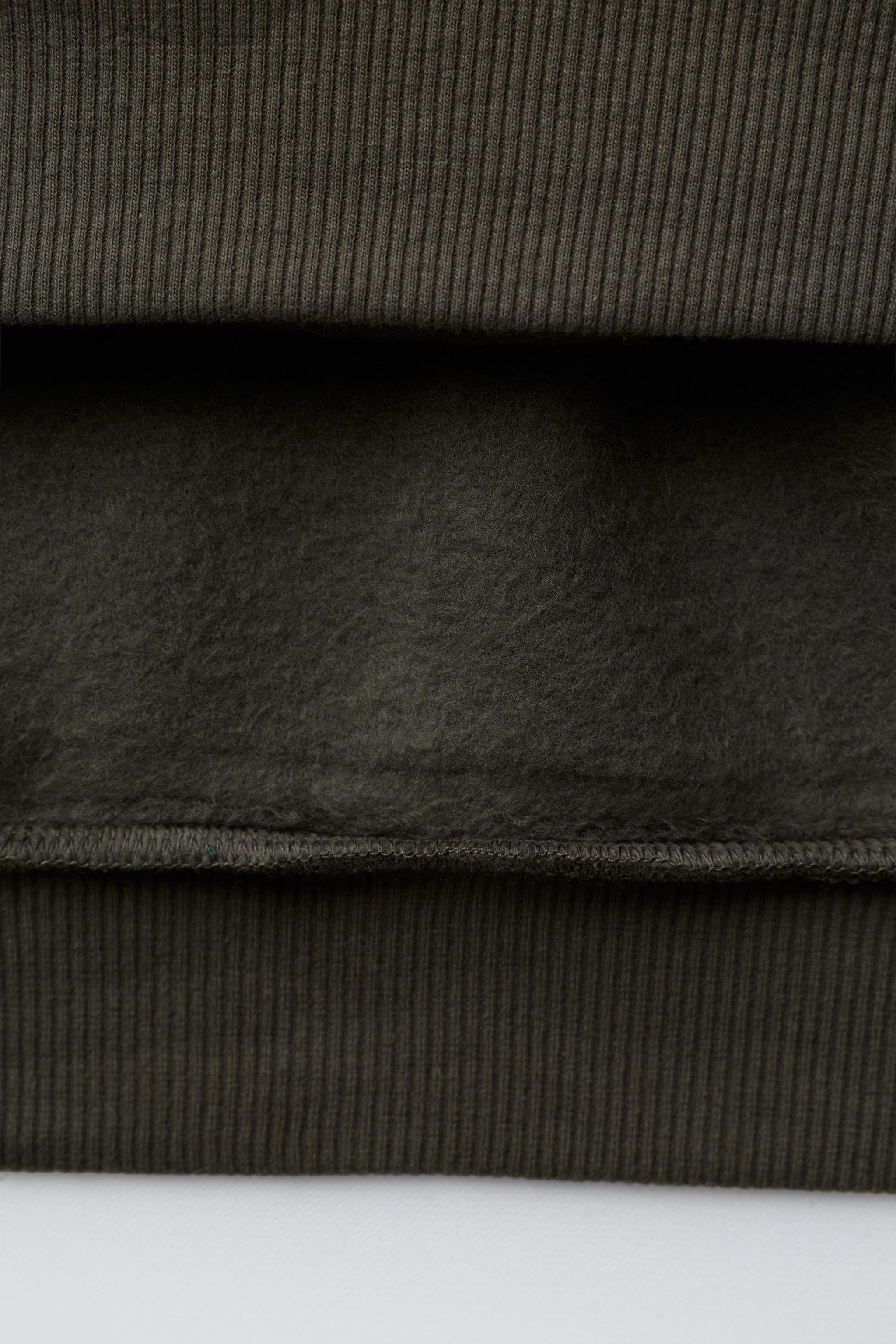 HOODIE WITH EMBOSSED TEXT PRINT